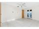 Spacious main bedroom featuring tile floors and glass doors to the lanai at 3220 Peace River Dr, Punta Gorda, FL 33983