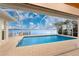 Enclosed pool area with a beautiful view of the water and dock; perfect for relaxation and outdoor entertainment at 3220 Peace River Dr, Punta Gorda, FL 33983