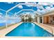 Relaxing screened-in pool with water views at 3220 Peace River Dr, Punta Gorda, FL 33983