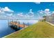 Private dock and grassy waterfront area at 3220 Peace River Dr, Punta Gorda, FL 33983