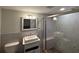 Updated bathroom with a white vanity, walk-in shower, and modern fixtures at 4525 Church St, Punta Gorda, FL 33980