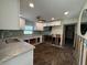 Renovated kitchen with white shaker cabinets and granite countertops at 4525 Church St, Punta Gorda, FL 33980