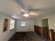 Living room with white walls and wood flooring, undergoing renovation at 4525 Church St, Punta Gorda, FL 33980