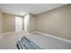 Unfinished basement with a white door and light-grey flooring at 511 Corto Andra St, Punta Gorda, FL 33950