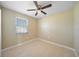 Well-lit bedroom featuring a ceiling fan and window at 511 Corto Andra St, Punta Gorda, FL 33950