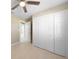 Bedroom with double-door closet and ceiling fan at 511 Corto Andra St, Punta Gorda, FL 33950
