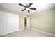 Bright bedroom with ceiling fan and large closet at 511 Corto Andra St, Punta Gorda, FL 33950