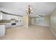 Modern kitchen with white cabinets, granite countertops, and stainless steel appliances at 511 Corto Andra St, Punta Gorda, FL 33950