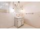 Bathroom with vintage vanity and light fixtures at 515 W Olympia Ave, Punta Gorda, FL 33950