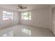 Spacious bedroom with large window and ceiling fan at 515 W Olympia Ave, Punta Gorda, FL 33950