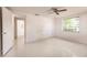 Simple bedroom with window and access to hallway at 515 W Olympia Ave, Punta Gorda, FL 33950