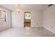 Dining room with chandelier and view into kitchen at 515 W Olympia Ave, Punta Gorda, FL 33950