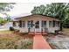 House exterior showcasing a classic design and well-maintained lawn at 515 W Olympia Ave, Punta Gorda, FL 33950