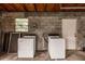 Garage with washer, dryer hookups and storage at 515 W Olympia Ave, Punta Gorda, FL 33950