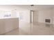 Open living space with a half wall and terrazzo flooring at 515 W Olympia Ave, Punta Gorda, FL 33950