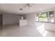 Bright living room features large window and terrazzo flooring at 515 W Olympia Ave, Punta Gorda, FL 33950