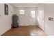 Unfinished mechanical room with water heater and access door at 515 W Olympia Ave, Punta Gorda, FL 33950