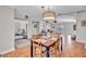 Open dining room with view into living room and hardwood floors at 98 Seasons Dr, Punta Gorda, FL 33983