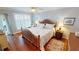 Cozy bedroom with hardwood floors, plantation shutters and coastal decor at 1 Colony Point Dr # 16C, Punta Gorda, FL 33950