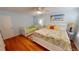 Bright bedroom with hardwood floors, a daybed, and beachy accents at 1 Colony Point Dr # 16C, Punta Gorda, FL 33950