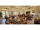 This roomy clubhouse features multiple round tables, stylish seating, and lots of natural light at 1 Colony Point Dr # 16C, Punta Gorda, FL 33950