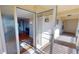 View of home's interior from screened front entryway with glass adorned door at 1 Colony Point Dr # 16C, Punta Gorda, FL 33950