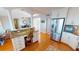 Bright kitchen area with desk, breakfast bar seating, and stainless steel appliances at 1 Colony Point Dr # 16C, Punta Gorda, FL 33950