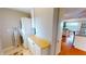 Bright laundry area features a stacked washer/dryer with storage space conveniently located near the living area at 1 Colony Point Dr # 16C, Punta Gorda, FL 33950