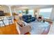 Inviting living room with modern furnishings and serene water views from large windows at 1 Colony Point Dr # 16C, Punta Gorda, FL 33950