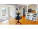 Bright living room with breakfast bar, pendant lighting, and access to outdoor balcony at 1 Colony Point Dr # 16C, Punta Gorda, FL 33950