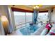 Living room with water views, comfortable seating, and ample natural light at 1 Colony Point Dr # 16C, Punta Gorda, FL 33950