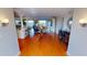 Spacious living room with wood floors, pillars, and beautiful water views at 1 Colony Point Dr # 16C, Punta Gorda, FL 33950
