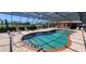 Community pool with covered patio and lounge chairs at 1 Colony Point Dr # 16C, Punta Gorda, FL 33950