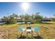 Relaxing canal view with fire pit and seating area at 103 Salem Ave Nw, Port Charlotte, FL 33952