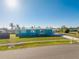 Street view of teal ranch home with yard at 103 Salem Ave Nw, Port Charlotte, FL 33952