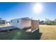 White storage shed with wooden deck and privacy wall at 103 Salem Ave Nw, Port Charlotte, FL 33952