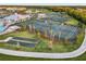 Aerial view of tennis courts and clubhouse at 14061 Heritage Landing Blvd # 415, Punta Gorda, FL 33955