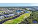 Aerial view of upscale community with golf course, waterways, and luxury homes at 14061 Heritage Landing Blvd # 415, Punta Gorda, FL 33955