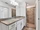 Bathroom with granite vanity and walk-in shower at 14061 Heritage Landing Blvd # 415, Punta Gorda, FL 33955
