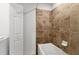Clean bathroom with a bathtub and tiled walls at 14061 Heritage Landing Blvd # 415, Punta Gorda, FL 33955