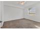 Bright bedroom with ceiling fan and neutral carpeting at 14061 Heritage Landing Blvd # 415, Punta Gorda, FL 33955