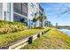Building exterior with water view and landscaping at 14061 Heritage Landing Blvd # 415, Punta Gorda, FL 33955
