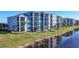 Building exterior and landscaping along the water at 14061 Heritage Landing Blvd # 415, Punta Gorda, FL 33955