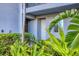 Private condo entrance with tropical landscaping at 14061 Heritage Landing Blvd # 415, Punta Gorda, FL 33955