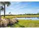 Landscaped backyard with scenic golf course view at 14061 Heritage Landing Blvd # 415, Punta Gorda, FL 33955