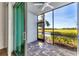 Screened patio overlooking a pond and golf course at 14061 Heritage Landing Blvd # 415, Punta Gorda, FL 33955