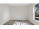 Bedroom with large window and wood-look flooring at 1451 Glenview Rd, North Port, FL 34288