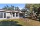 Single story home with backyard patio and firepit at 1451 Glenview Rd, North Port, FL 34288