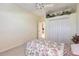 Bright bedroom with single bed, closet, and access to bathroom at 17347 Lake Worth Blvd, Port Charlotte, FL 33948