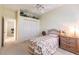 Charming bedroom with single bed, closet, and ceiling fan at 17347 Lake Worth Blvd, Port Charlotte, FL 33948